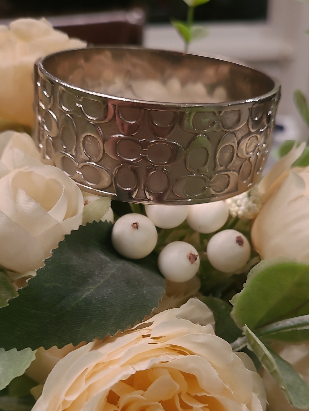 Coach Silver Tone Bangle Bracelet with Embossed Pattern